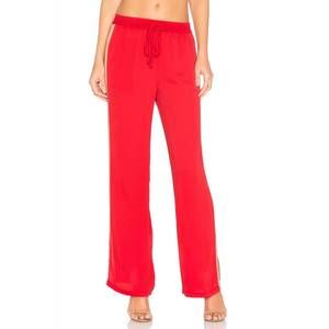NEW L'ACADEMIE track pant in redclay & camel
